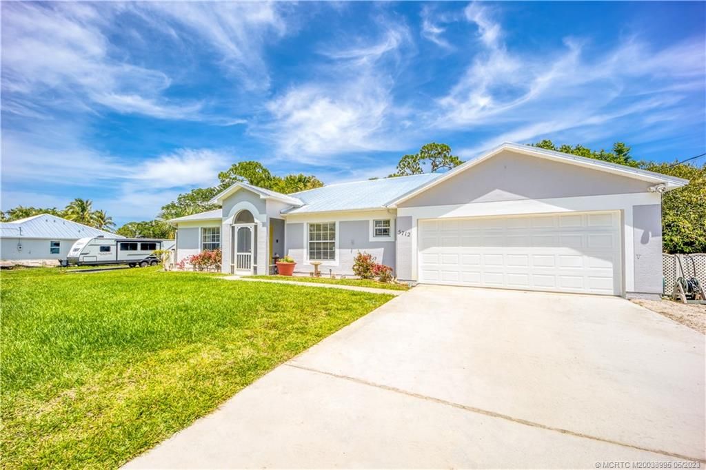 Photo of 5712 Tangelo Drive, Fort Pierce, FL 34982 (MLS # M20038995)