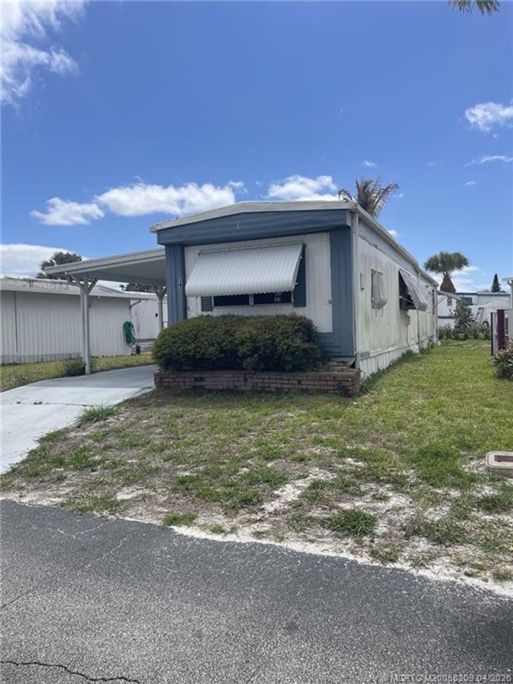 Photo of 345 NE Tropicalia Lane, Jensen Beach, FL 34957 (MLS # M20055309)