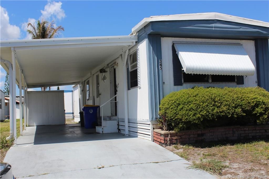 Photo of 345 NE Tropicalia Lane, Jensen Beach, FL 34957 (MLS # M20055309)