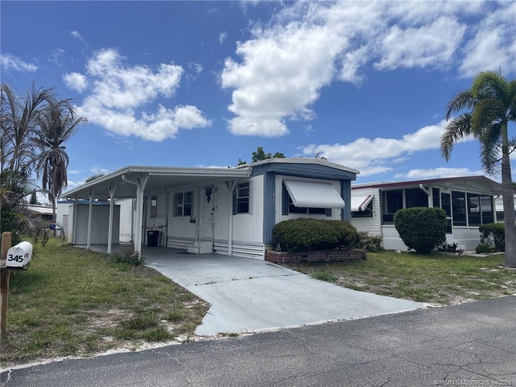 Photo of 345 NE Tropicalia Lane, Jensen Beach, FL 34957 (MLS # M20055309)