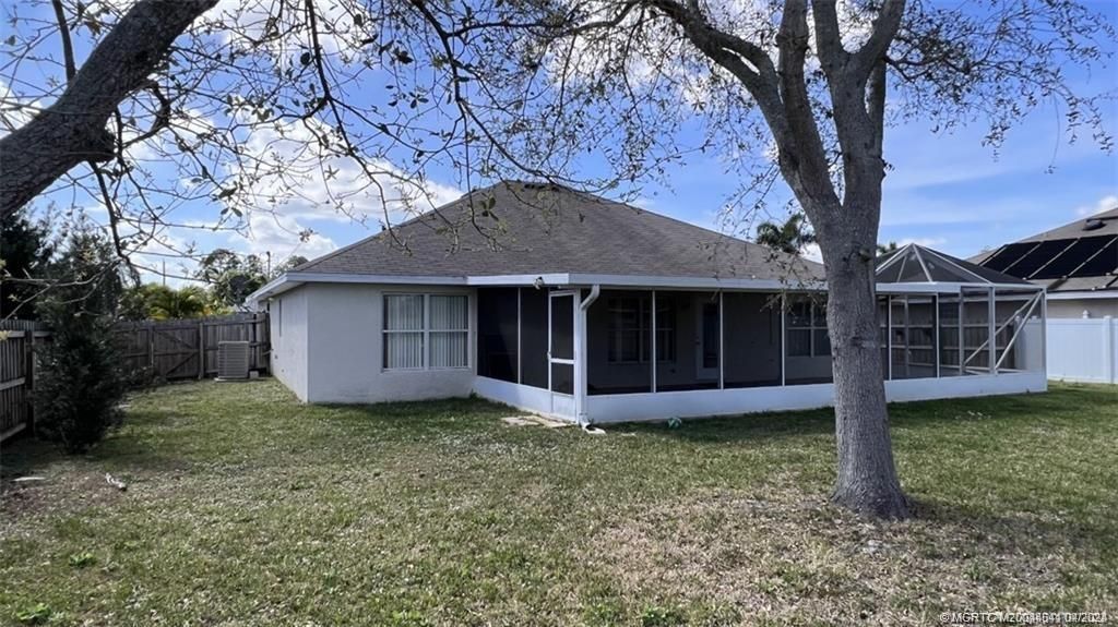 Photo of 471 NW Raymond Lane NW, Port Saint Lucie, FL 34983 (MLS # M20044541)