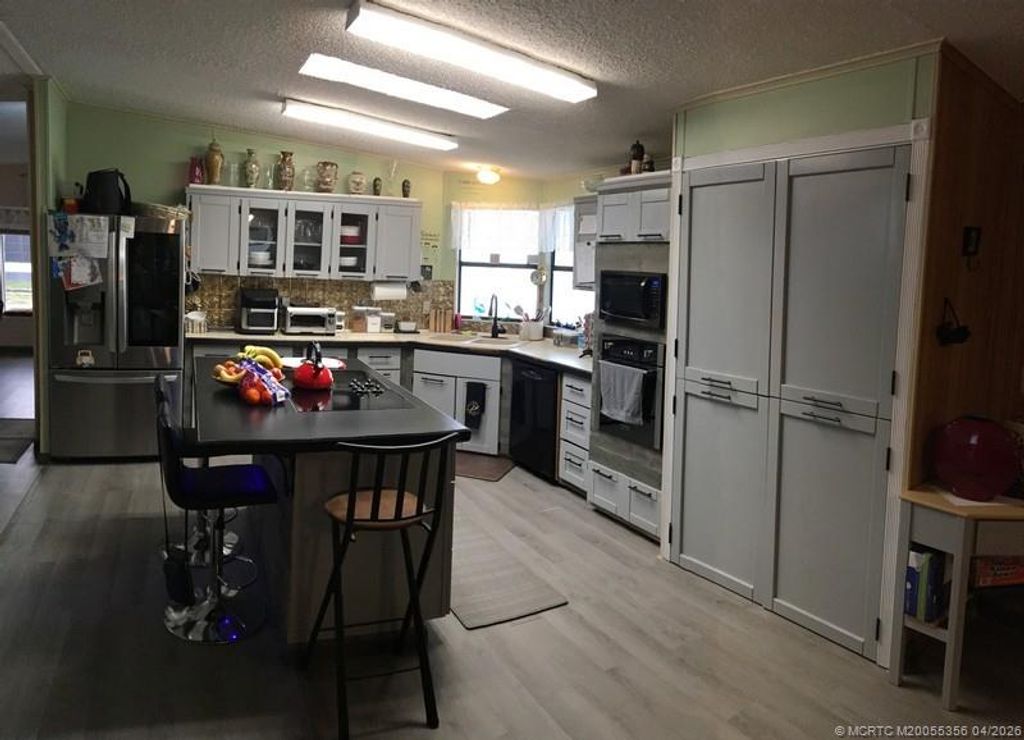 Photo of 14391 SW Divot Drive Dr, Indiantown, FL 34956 (MLS # M20055356)