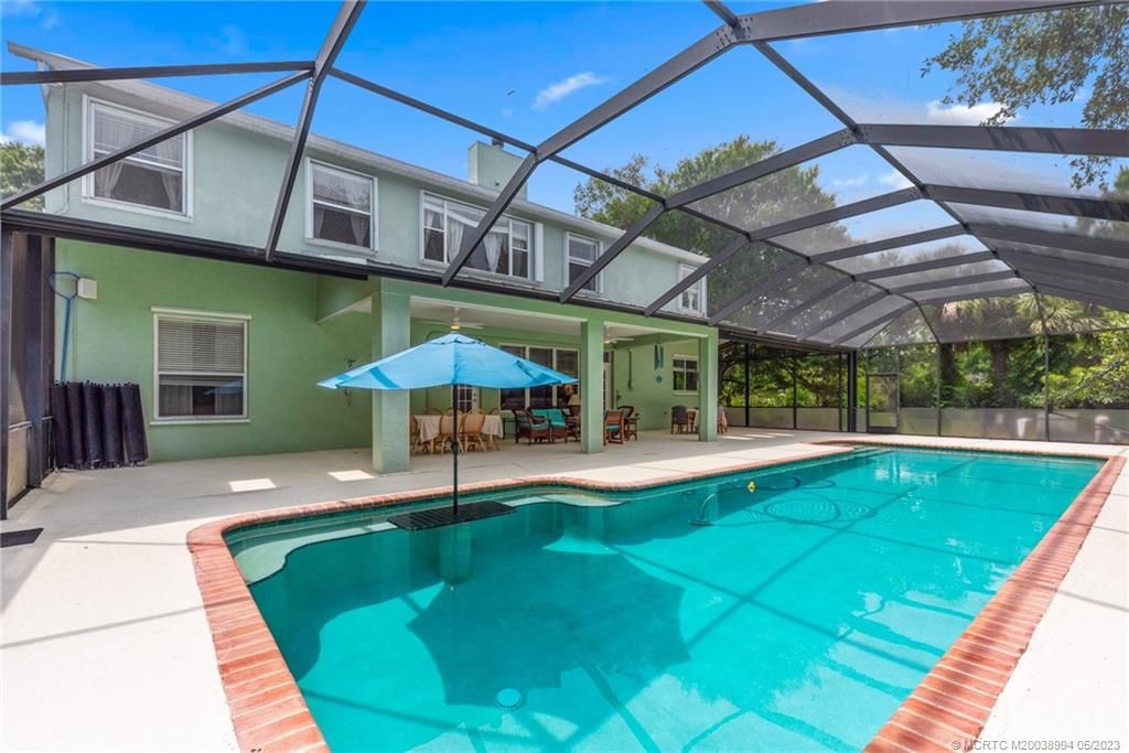 Photo of 10201 SW Tarzan Terrace, Palm City, FL 34990 (MLS # M20038994)