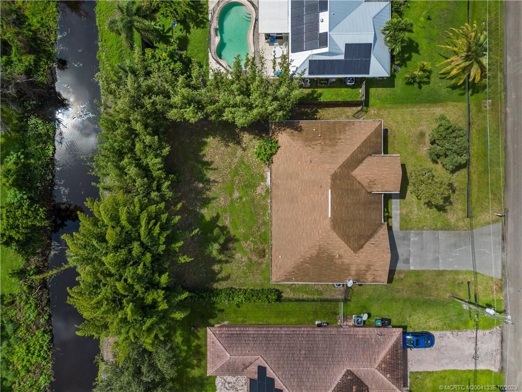 Photo of 1002 SW Mccall Road, Port Saint Lucie, FL 34953 (MLS # M20041335)