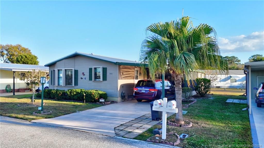 Photo of 581 Barb Ann Lane, Port Saint Lucie, FL 34952 (MLS # M20053755)