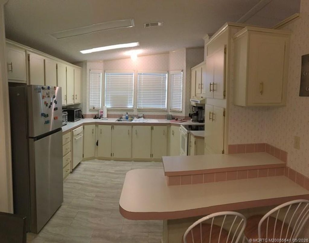 Photo of 16105 SW Indianwood Circle CIR #J-30, Indiantown, FL 34956 (MLS # M20055641)