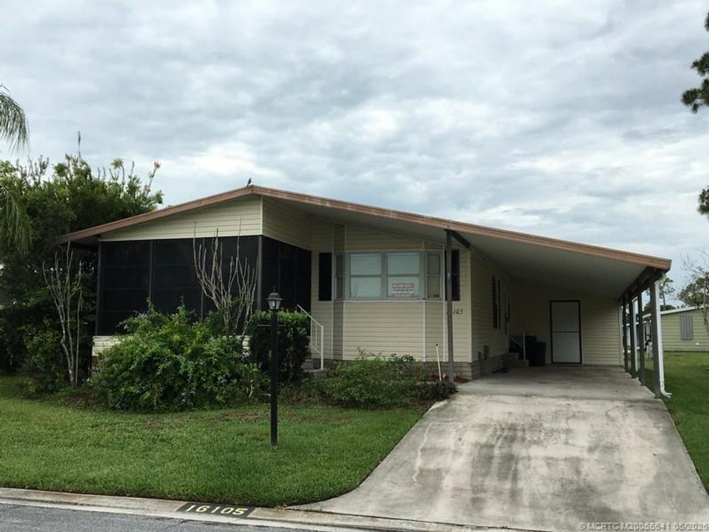 Photo of 16105 SW Indianwood Circle CIR #J-30, Indiantown, FL 34956 (MLS # M20055641)