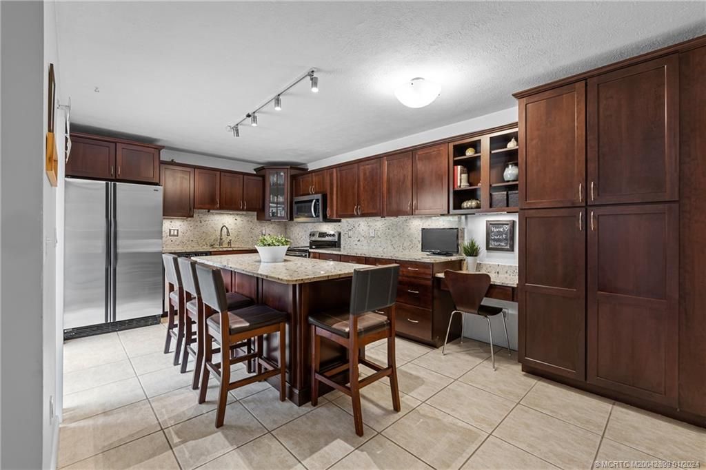 Photo of 6492 SE Windsong Lane #714, Stuart, FL 34997 (MLS # M20042899)