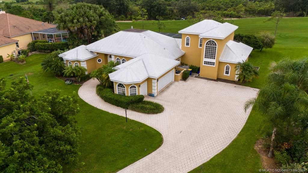 Photo of 10567 SW Whooping Crane Way, Palm City, FL 34990 (MLS # M20046577)