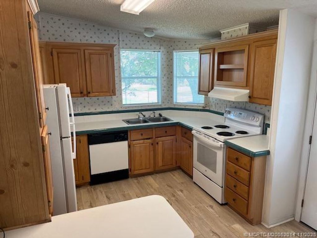 Photo of 2671 SW Versailles Terrace, Stuart, FL 34997 (MLS # M20052014)