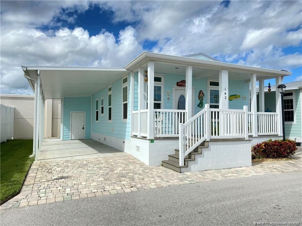 Photo of 142 NE Coastal Drive, Jensen Beach, FL 34957 (MLS # M20055698)