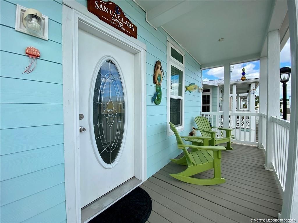 Photo of 142 NE Coastal Drive, Jensen Beach, FL 34957 (MLS # M20055698)
