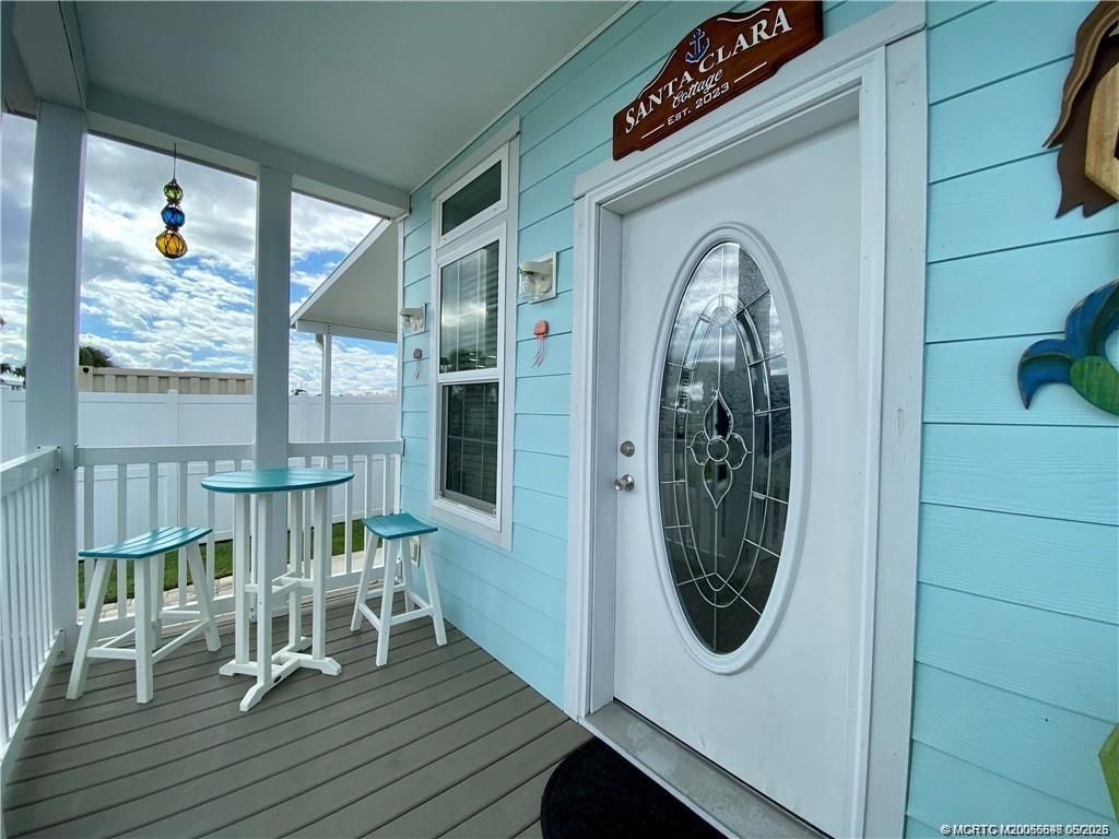 Photo of 142 NE Coastal Drive, Jensen Beach, FL 34957 (MLS # M20055698)
