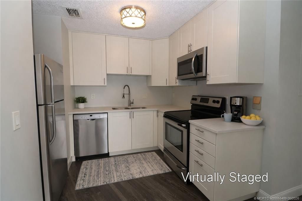 Photo of 2083 NE Collins Circle #8-90, Jensen Beach, FL 34957 (MLS # M20055489)