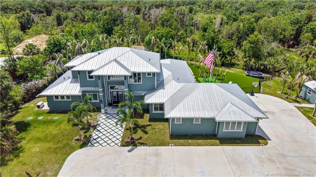 Photo of 6154 SW Woodham Street, Palm City, FL 34990 (MLS # M20055666)