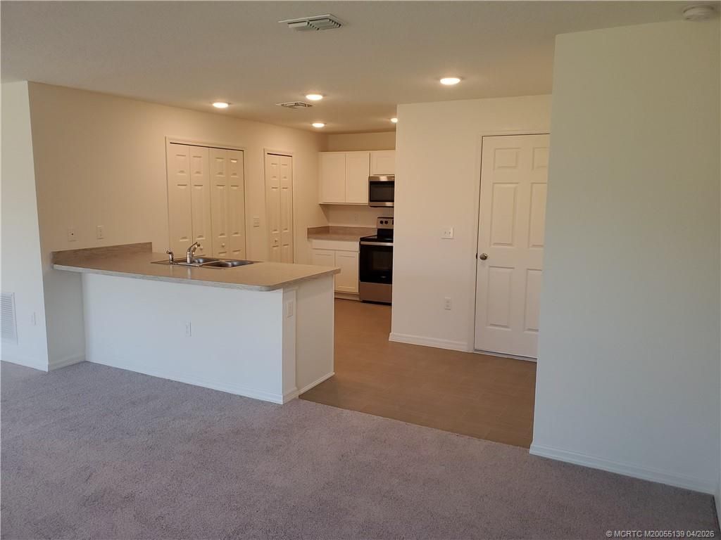 Photo of 611 SW McComb Avenue SW, Port Saint Lucie, FL 34953 (MLS # M20055139)