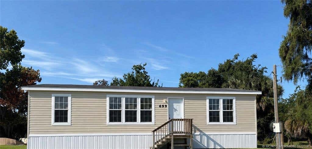 Photo of 699 4th Street, Moore Haven, FL 33471 (MLS # M20056092)