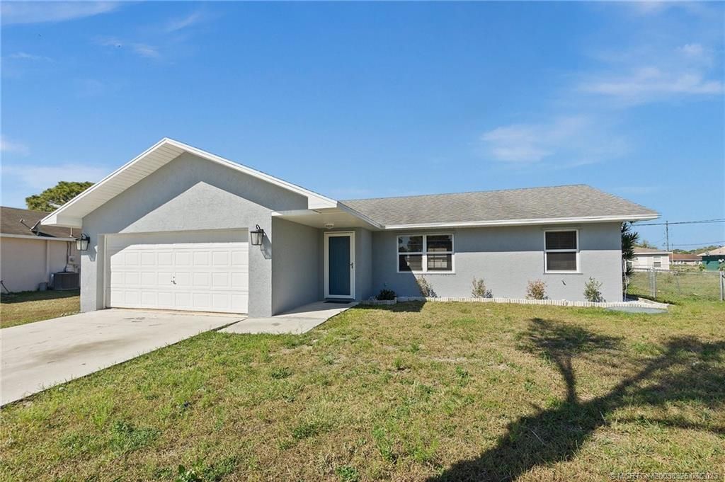 Photo of 335 NW Fairfax Avenue, Port Saint Lucie, FL 34983 (MLS # M20038326)