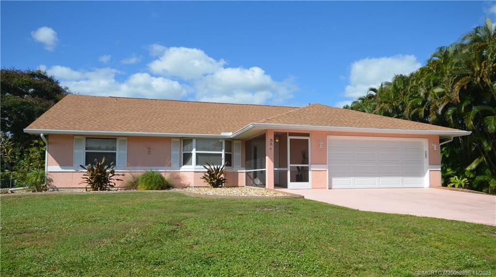 Photo of 321 SE Cork Road, Port Saint Lucie, FL 34984 (MLS # M20052896)