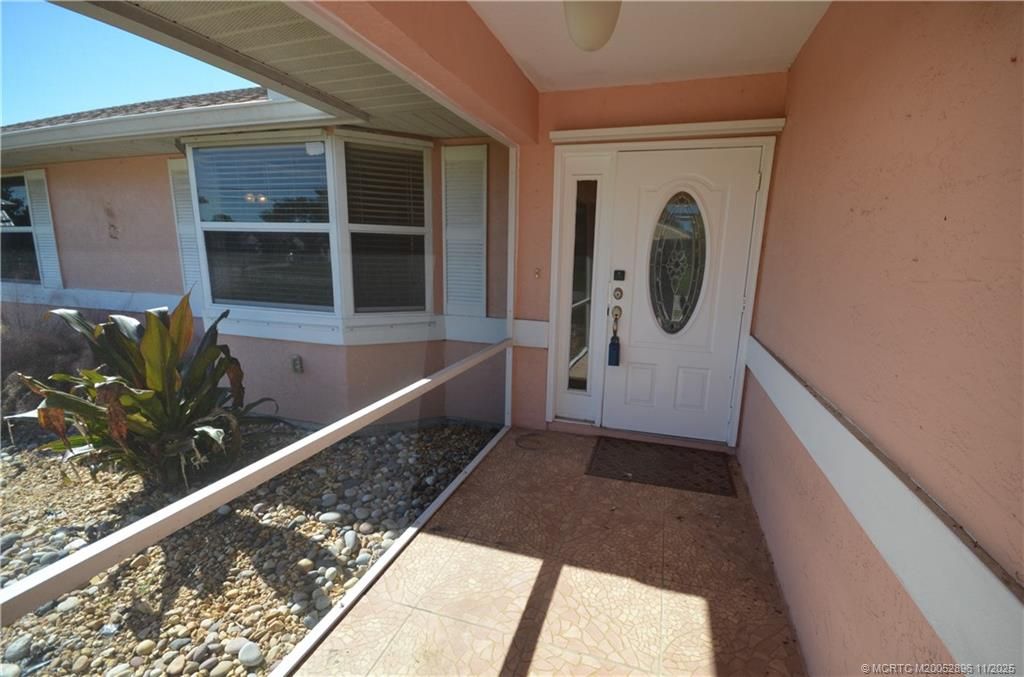 Photo of 321 SE Cork Road, Port Saint Lucie, FL 34984 (MLS # M20052896)