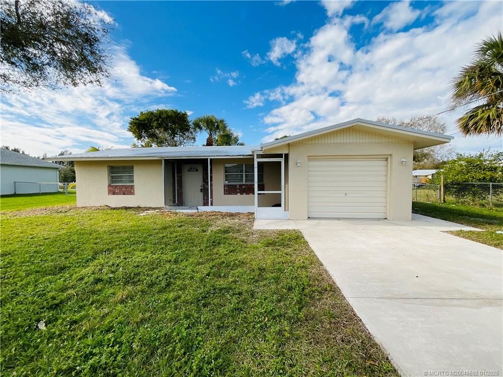 Photo of 5607 Myrtle Drive, Fort Pierce, FL 34982 (MLS # M20048592)