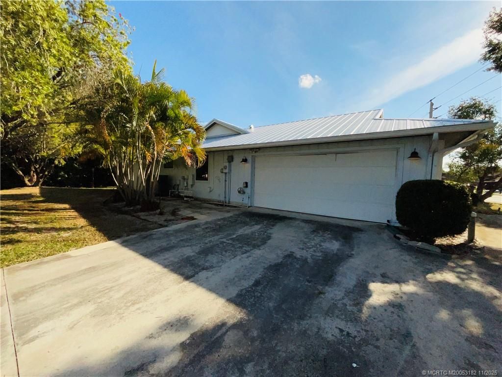 Photo of 2041 SE Floresta Drive, Port Saint Lucie, FL 34984 (MLS # M20053182)