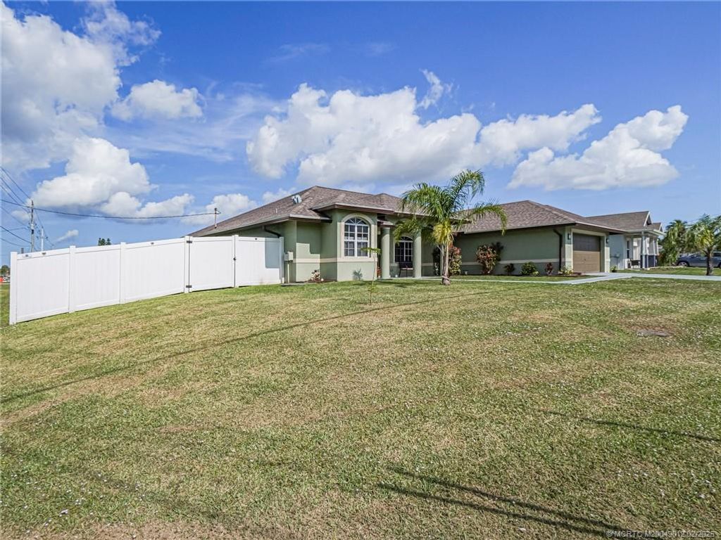 Photo of 1297 SW Ackard Avenue, Port Saint Lucie, FL 34953 (MLS # M20049012)