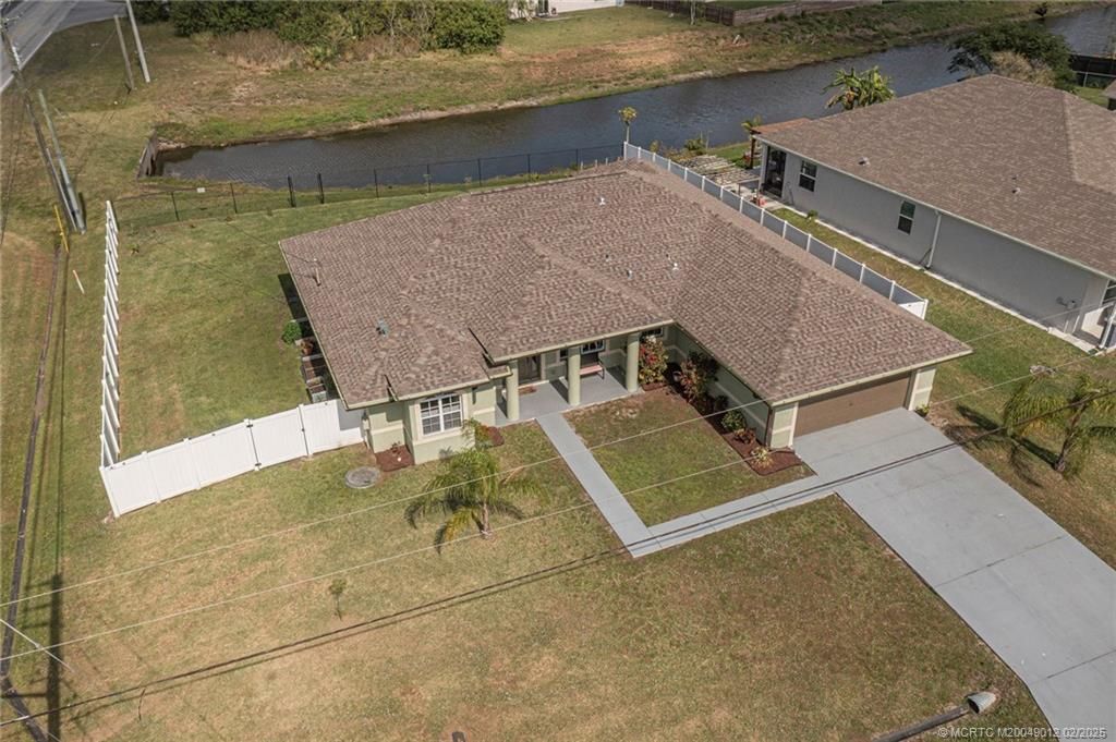 Photo of 1297 SW Ackard Avenue, Port Saint Lucie, FL 34953 (MLS # M20049012)