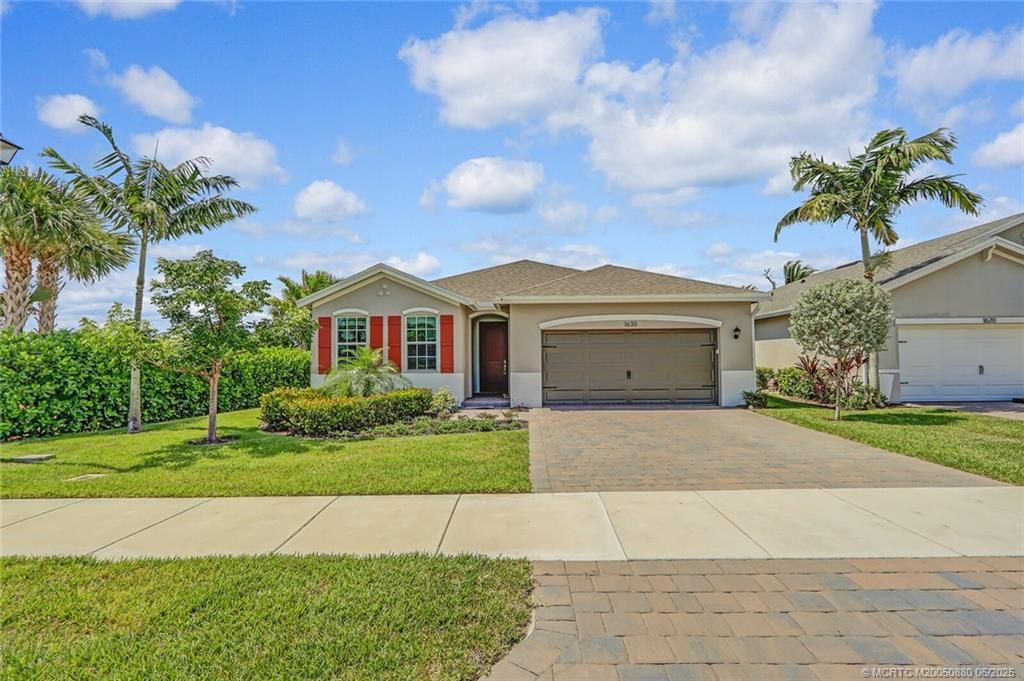 Photo of 1630 NE Skyhigh Terrace, Jensen Beach, FL 34957 (MLS # M20050880)