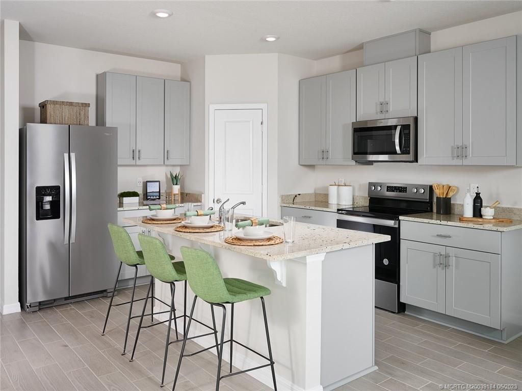 Photo of 5672 SE Edgewater Circle, Stuart, FL 34997 (MLS # M20039184)