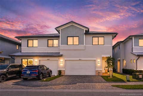 Photo of 3657 SW Magnolia Ridge Lane, Palm City, FL 34990 (MLS # M20056206)