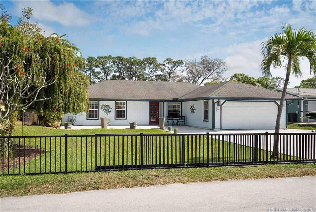 Photo of 1369 SW Covered Bridge Drive, Palm City, FL 34990 (MLS # M20049072)