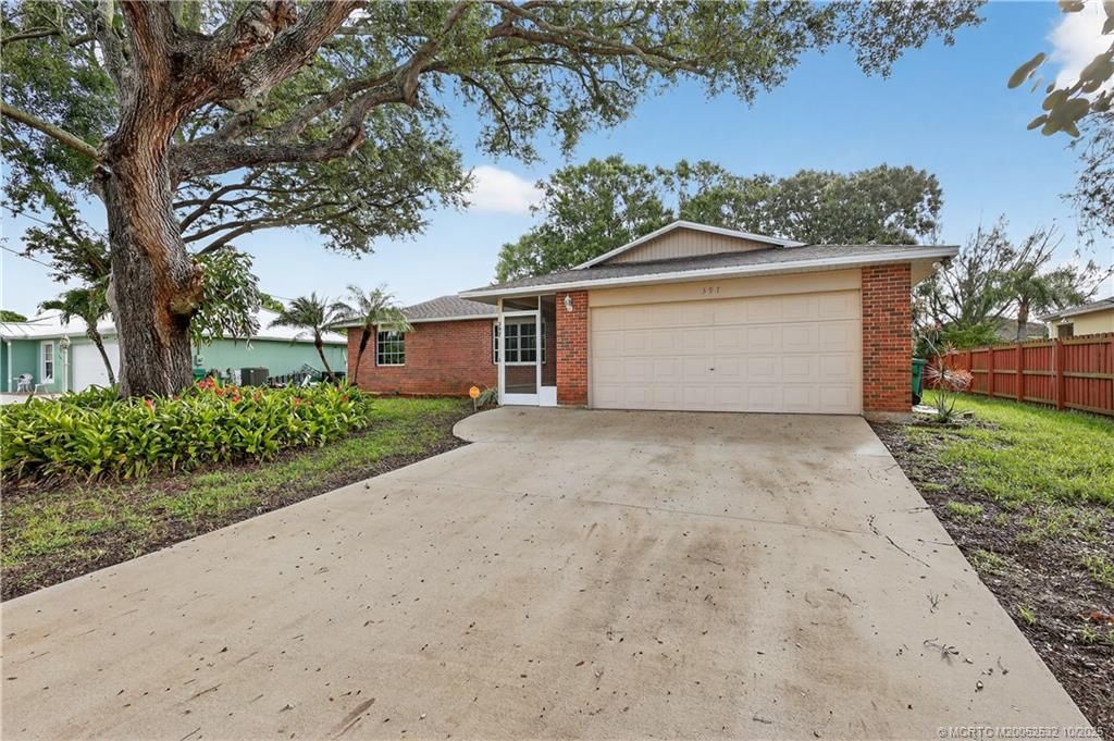 Photo of 397 NW Biltmore Street, Port Saint Lucie, FL 34983 (MLS # M20052532)