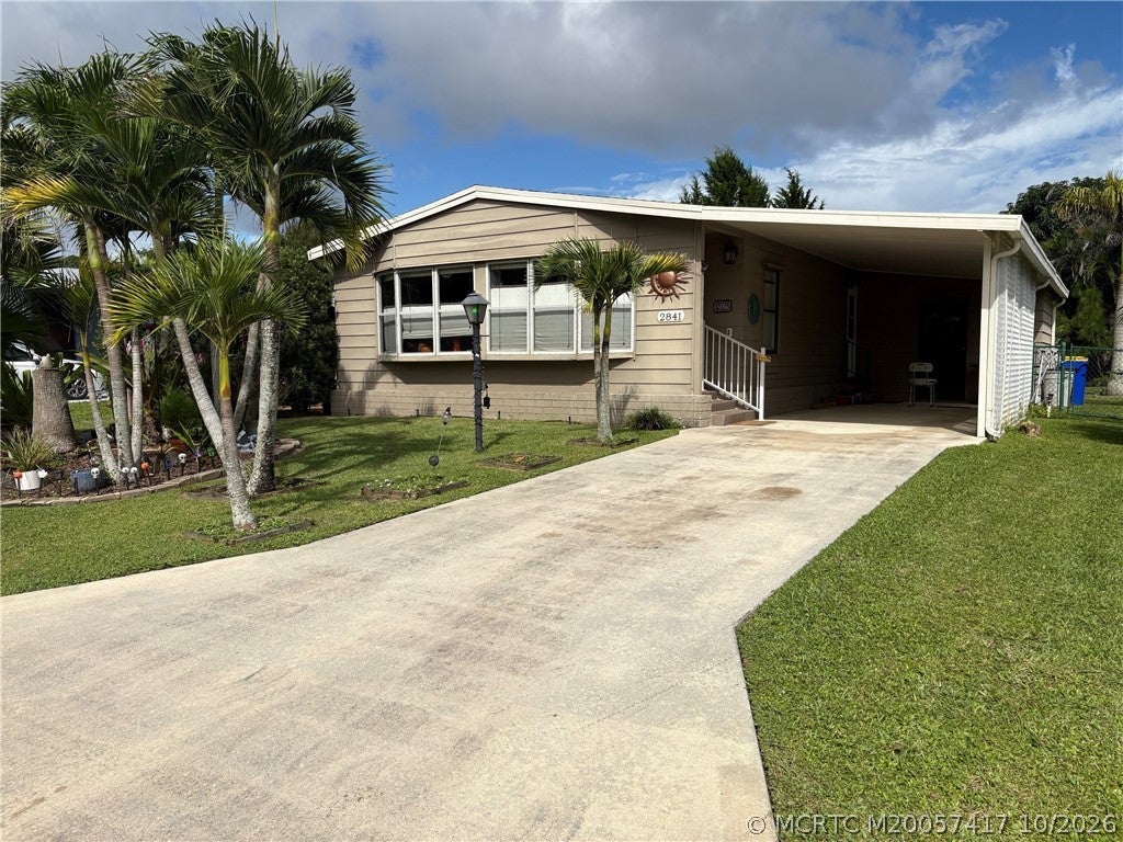 Photo of 2841 SW Monarch Trail, Stuart, FL 34997 (MLS # M20057417)