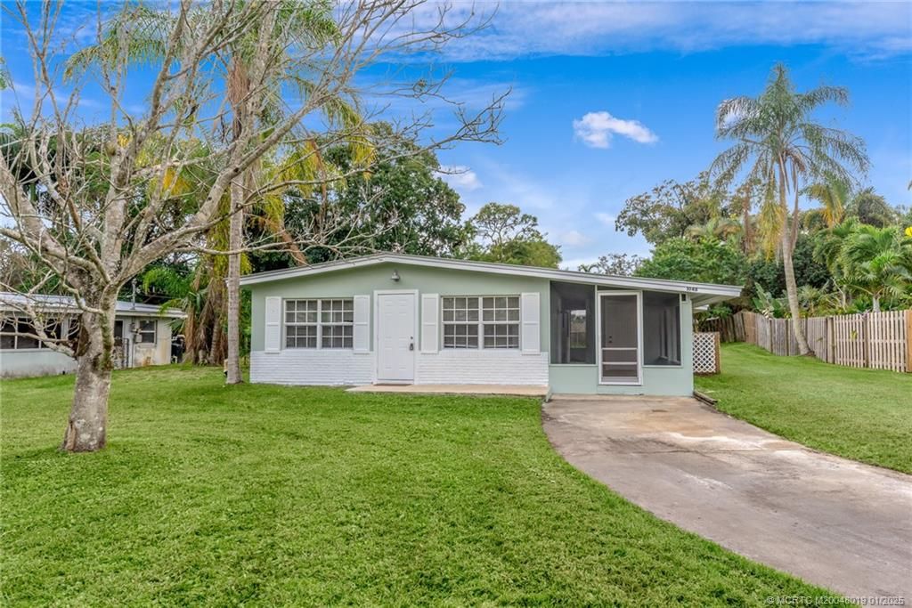 Photo of 1048 SW 30th Street, Palm City, FL 34990 (MLS # M20048019)