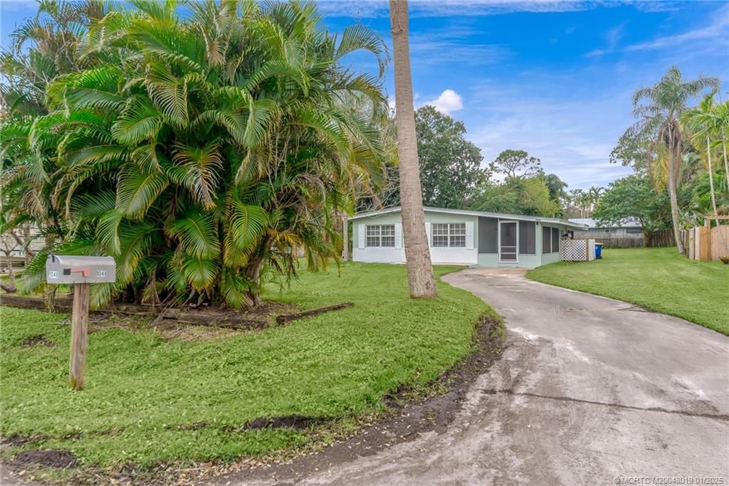 Photo of 1048 SW 30th Street, Palm City, FL 34990 (MLS # M20048019)