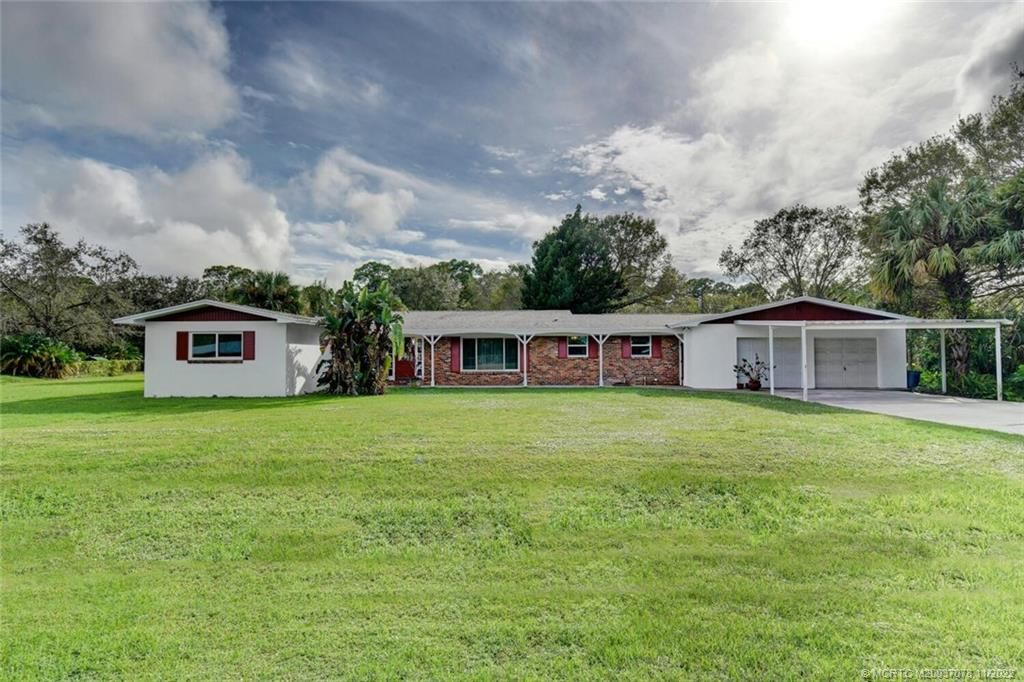 Photo of 5727 Briargate Lane, Fort Pierce, FL 34981 (MLS # M20037078)