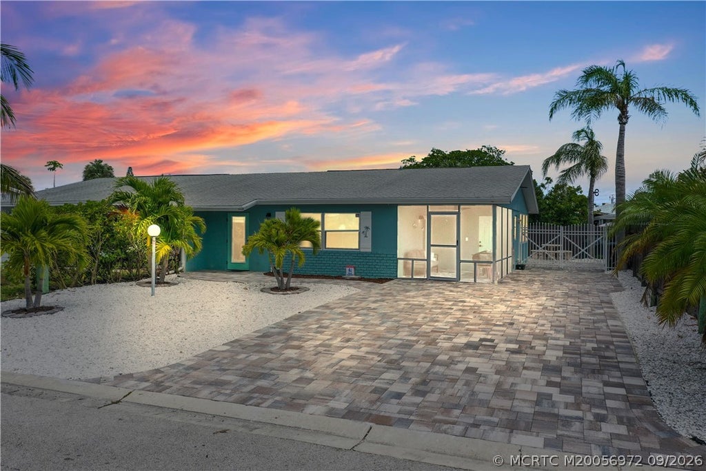 Photo of 87 S Las Olas Drive, Jensen Beach, FL 34957 (MLS # M20056972)