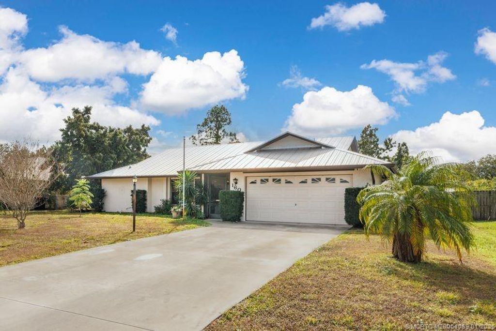 Photo of 160 SE Duxbury Avenue, Port Saint Lucie, FL 34983 (MLS # M20054059)
