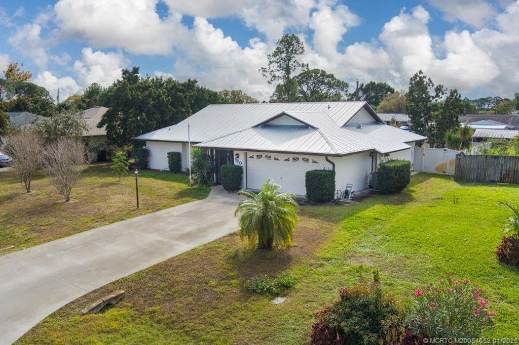 Photo of 160 SE Duxbury Avenue, Port Saint Lucie, FL 34983 (MLS # M20054059)