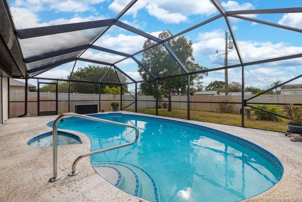 Photo of 160 SE Duxbury Avenue, Port Saint Lucie, FL 34983 (MLS # M20054059)