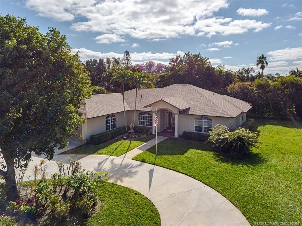 Photo of 2440 NE Pinecrest Lakes Boulevard, Jensen Beach, FL 34957 (MLS # M20043247)