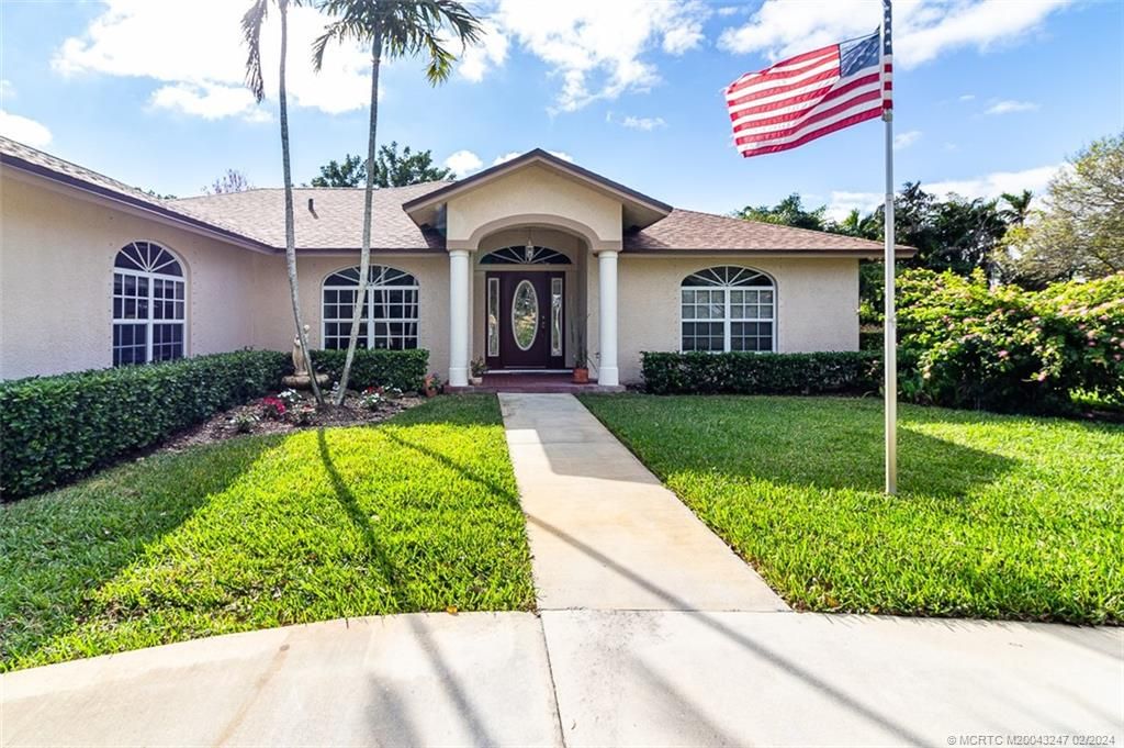 Photo of 2440 NE Pinecrest Lakes Boulevard, Jensen Beach, FL 34957 (MLS # M20043247)