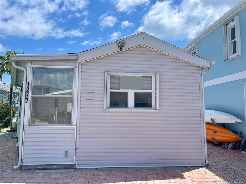 Photo of 1277 Nettles Boulevard, Jensen Beach, FL 34957 (MLS # M20050237)