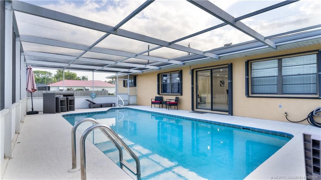 Photo of 2599 SE Westmoreland Boulevard, Port Saint Lucie, FL 34952 (MLS # M20051614)