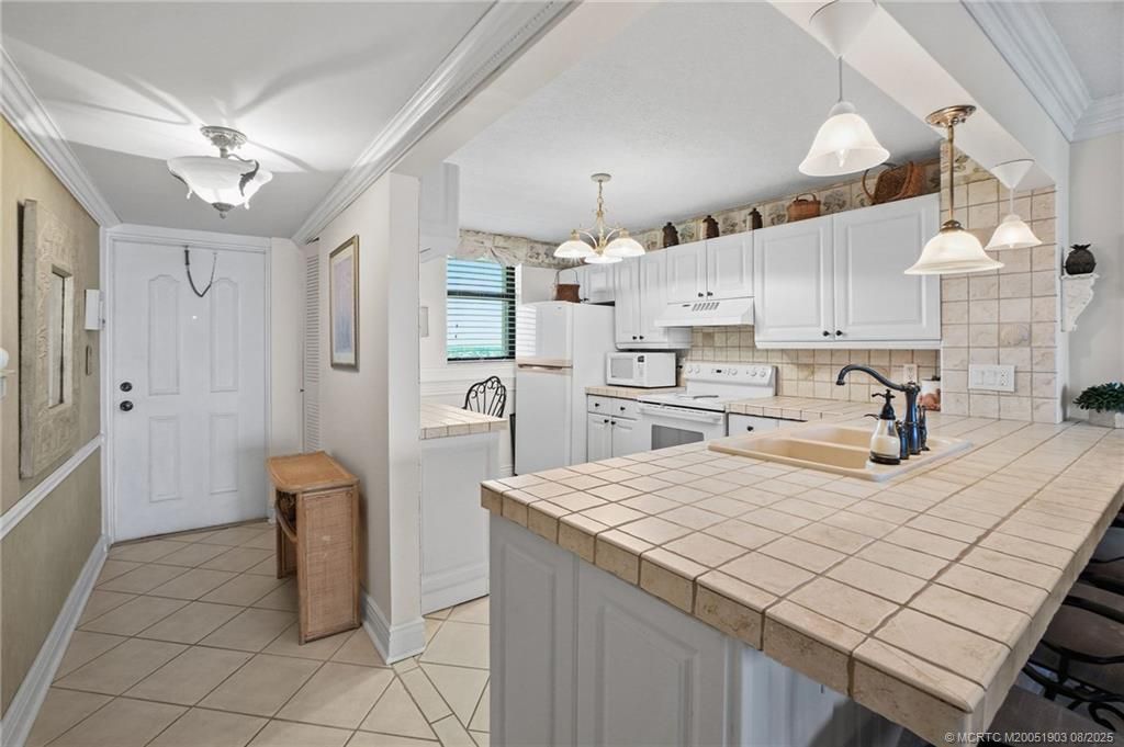 Photo of 9940 S Ocean Drive #907, Jensen Beach, FL 34957 (MLS # M20051903)