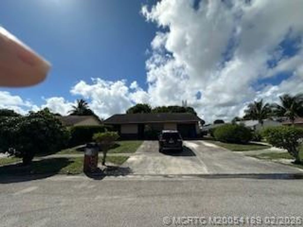 Photo of 1805 W 26th Street, Riviera Beach, FL 33404 (MLS # M20054189)