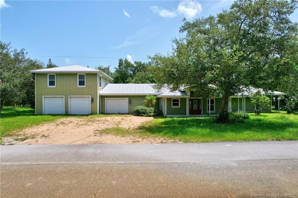 Photo of 1047 NE Kubin Avenue, Jensen Beach, FL 34957 (MLS # M20040724)
