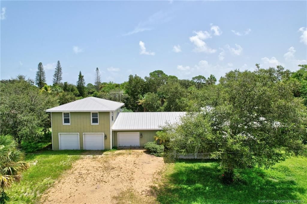Photo of 1047 NE Kubin Avenue, Jensen Beach, FL 34957 (MLS # M20040724)