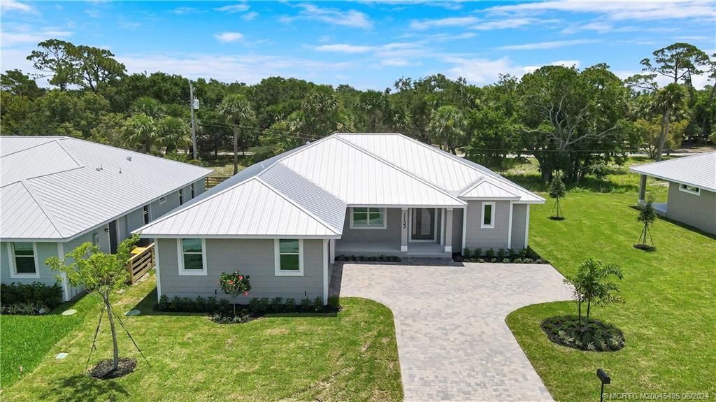 Photo of 1133 NE Orange Avenue, Jensen Beach, FL 34957 (MLS # M20045495)